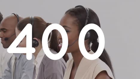 animation of numbers changing over people wearing phone headsets