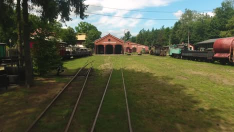 dynamic drone shot of an old train station