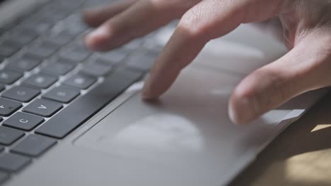 man is pinching and zooming on touchpad