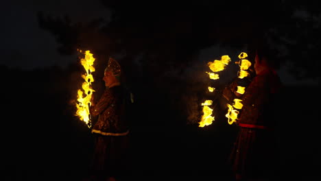 fire jugglers at night