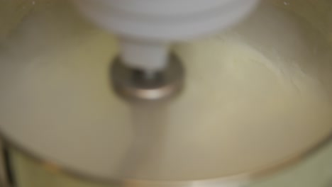 beating ice cream ingredients in a mixer bowl