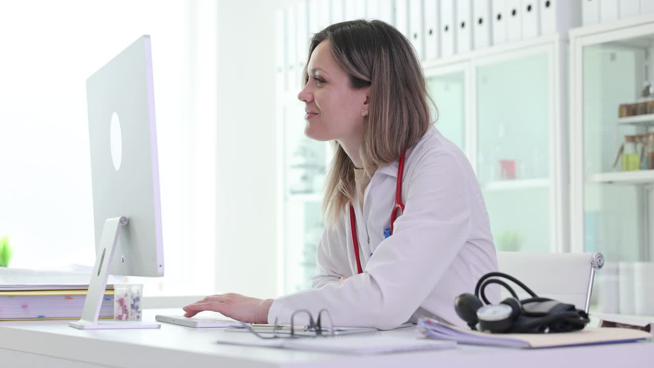 Doctor working on computer in clinic