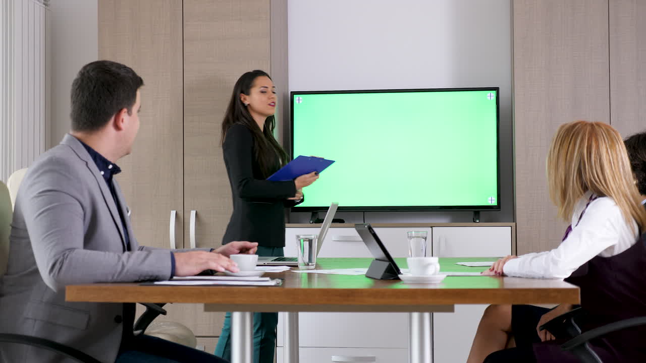 Business meeting with presentation on chroma key screen