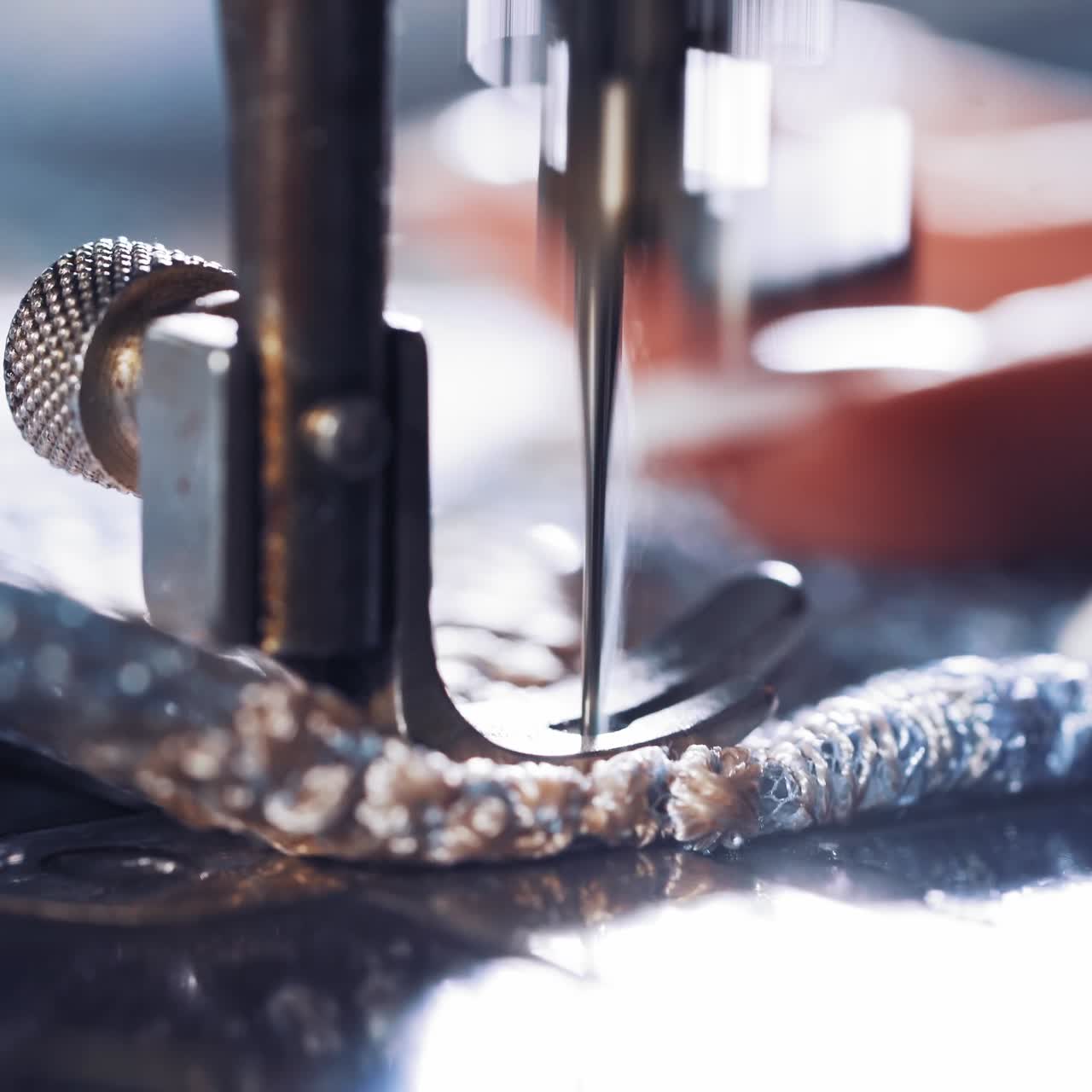 Hand on old sewing machine