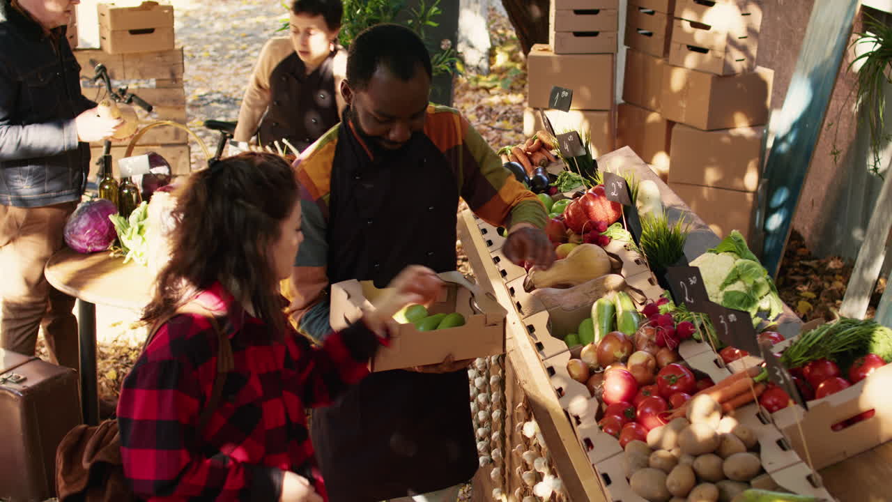 People shopping for produce at a farmers market