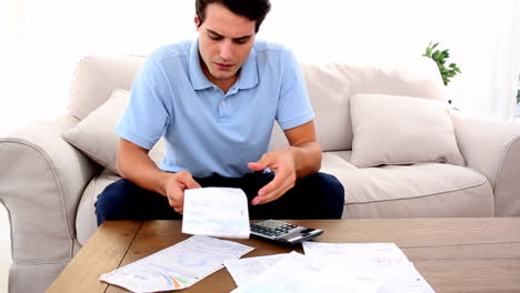 man stressed with so many bills to pay