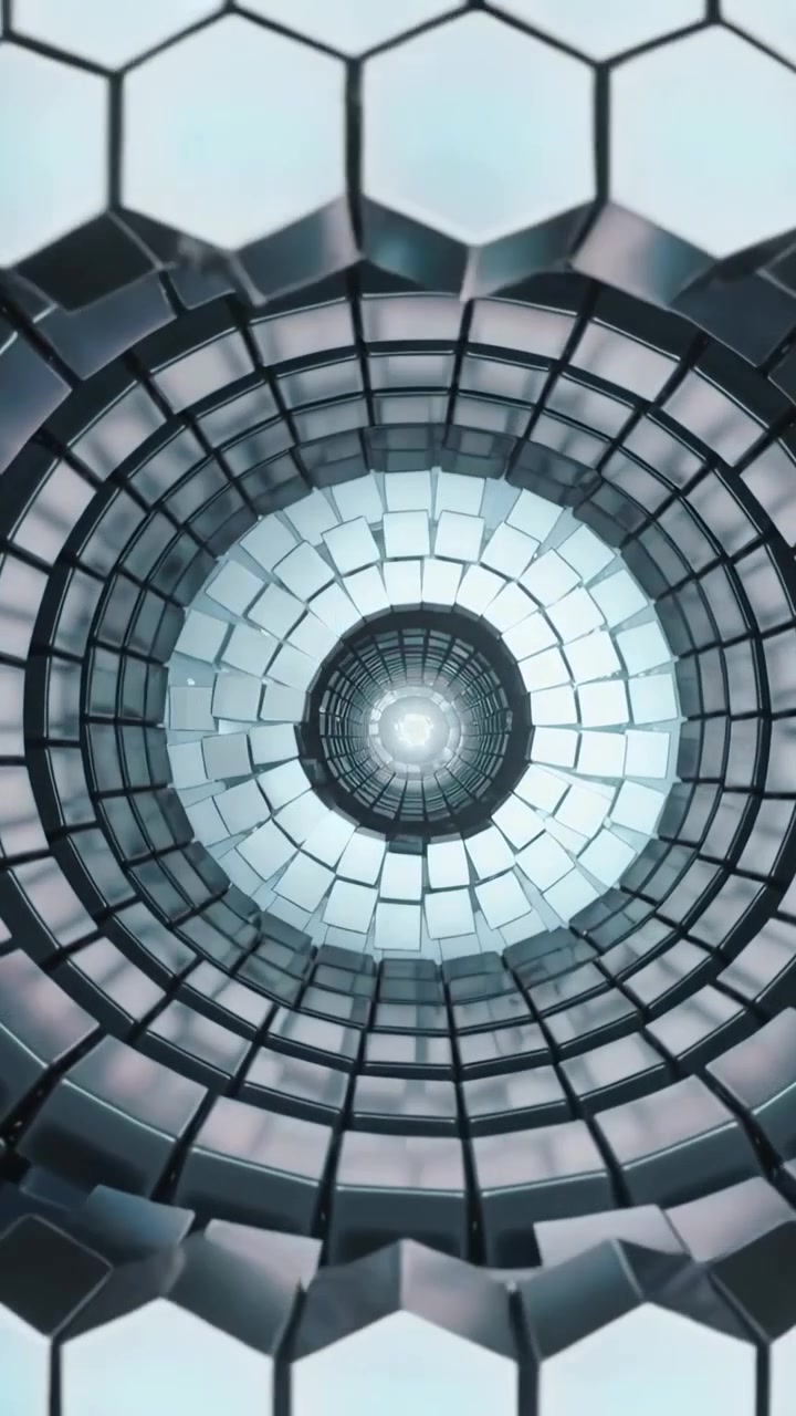 Vertical video: Opening hex tiles revealing spiral shaft with metal rings exposing core in chamber