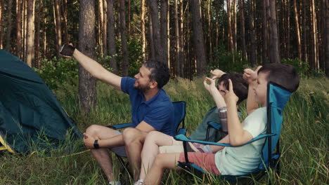 father with sons at the camping