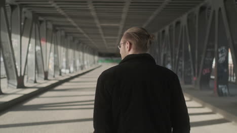 Young-European-Man-Walking-on-Empty-Street