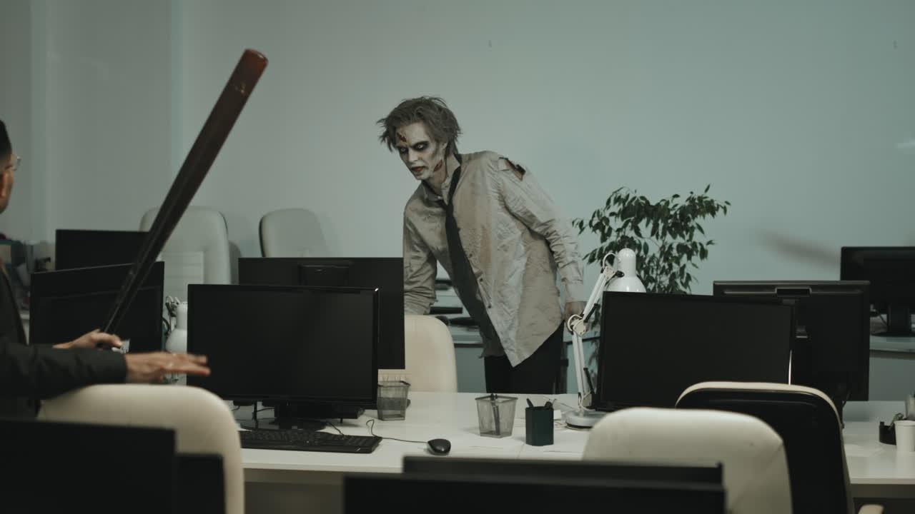Businessman with Baseball Bat and Zombie in Office