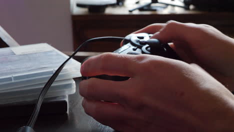 a professional esports player with a videogame controller during a competitive gaming match