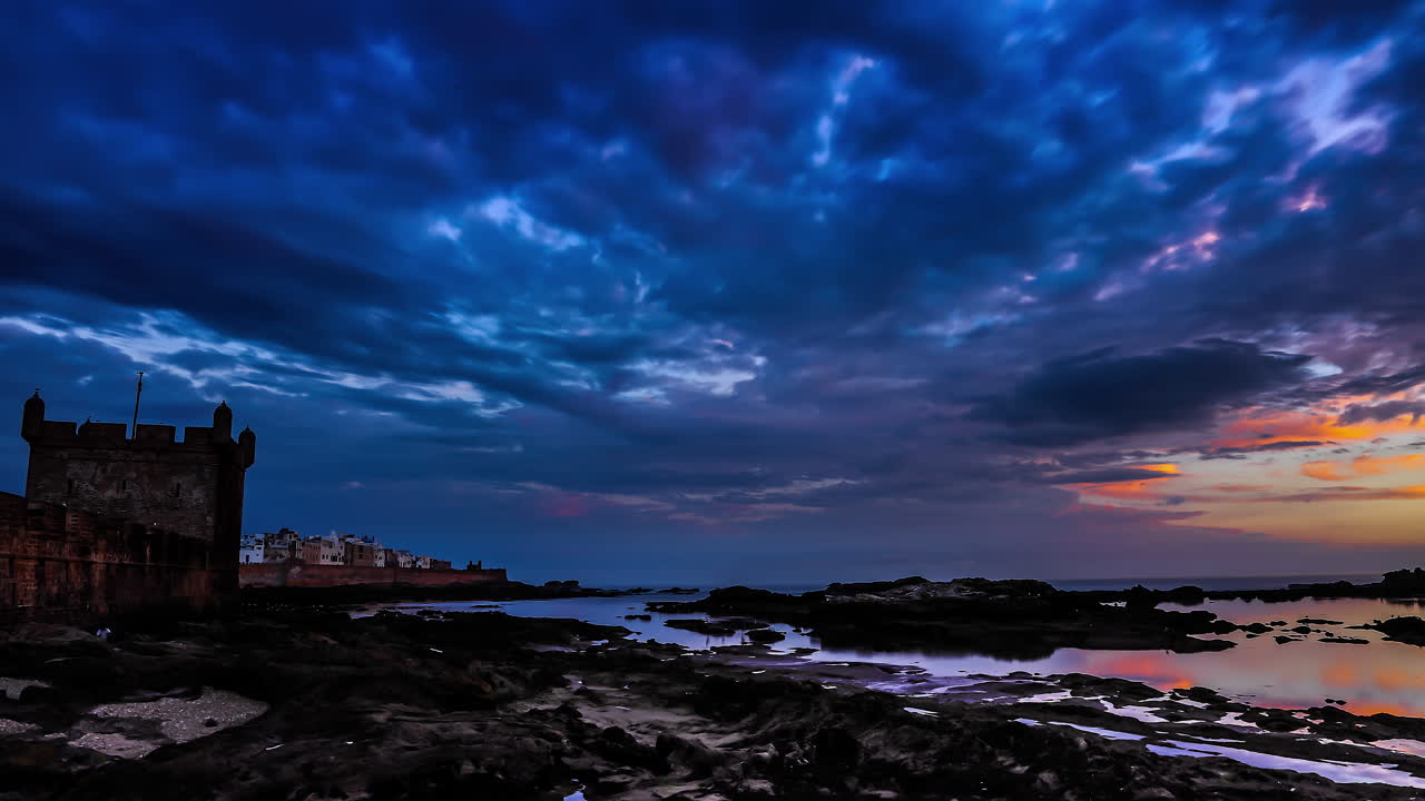 Historical castle and colorful vibrant dramatic cloudscape fusion time lapse