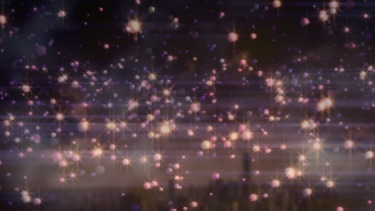 핑크 크리스마스 애니메이션은 배경에서 도시 풍경 위에 박이는 반점이 있습니다.