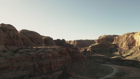 Shadow-covering-rock-formations-natural-structures,-canyon-location,-aerial