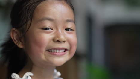 Asian-girl-face-portrait,-close-up-copy-space-shot-of-little-girl