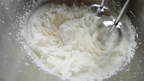 whipping cream in a metal bowl