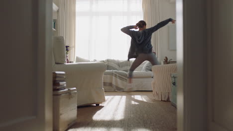 happy young woman dancing at home having fun celebrating with funny dance moves enjoying freedom on weekend morning 4k footage