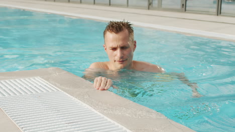 man swimming in a pool