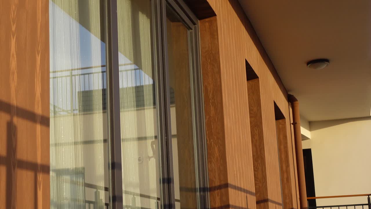 Modern Apartment Building Exterior with Wood Facade and Windows