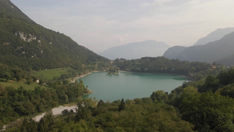 aerial view: drone shot reveals tenno lake, trentino, north italy