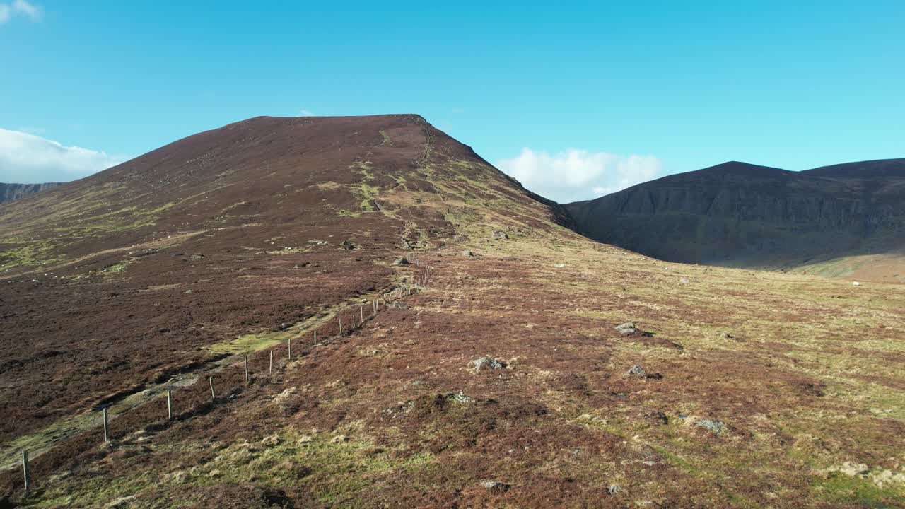 drone flying to mountain with fence and trail up the mountain Comeragh Mountains Waterford Epic Locations and Landscapes Ireland
