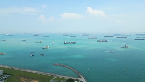 drone view of container ships sitting in the singapore bay strait