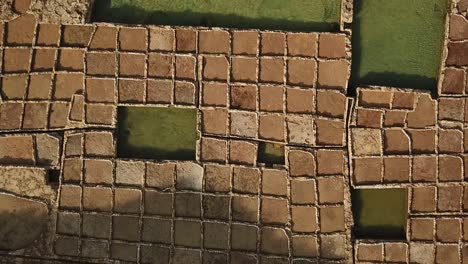 Aerial-view-of-the-salt-pans-at-Xwejni-bay,-Gozo,-Malta