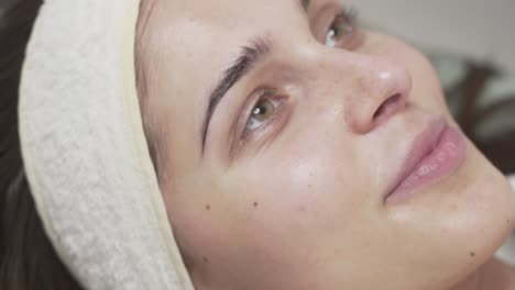 close up scene of a beautiful woman relaxing at the spa