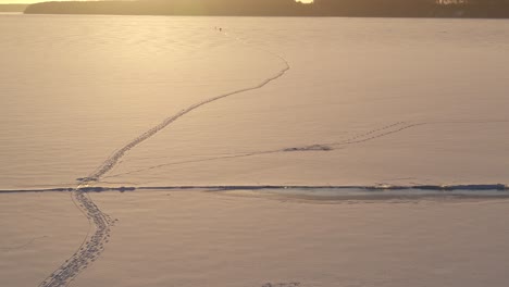 aerial view of frozen and covered in snow lagoon