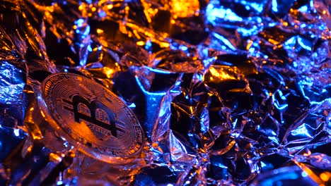 Bitcoin Coin on Reflective Foil