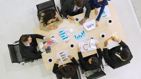 Business-people-group-meeting-shot-from-top-view