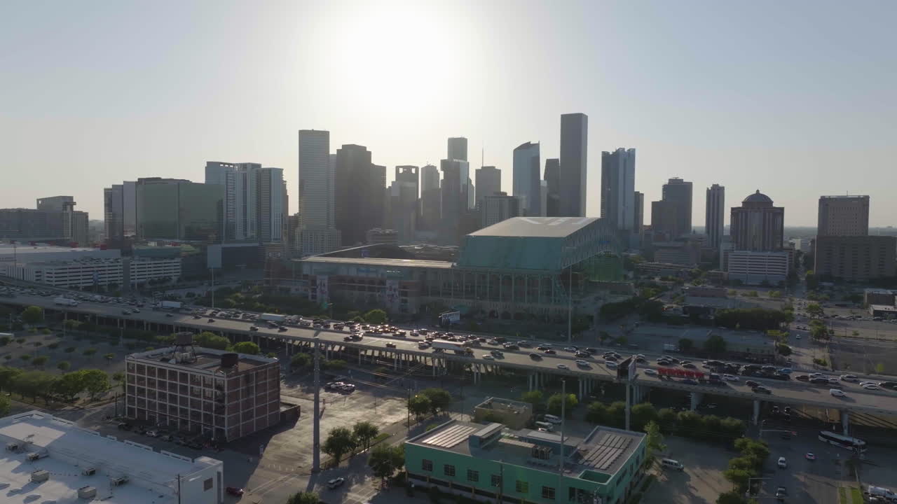 Aerial view of traffic in front of the Daikin Park, golden hour in Houston, USA