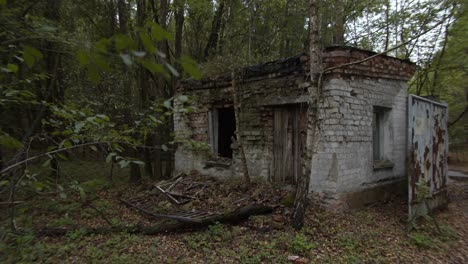 an abandoned brick shed by the forest in prypiat, chernobyl -wide