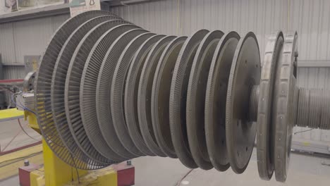 a steam turbine being turned manually in the open air