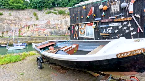 a boat docked near a scenic harbor