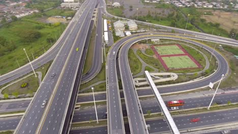 highway traffic and circle in bangkok thailand, aerial view and moving orbit shot