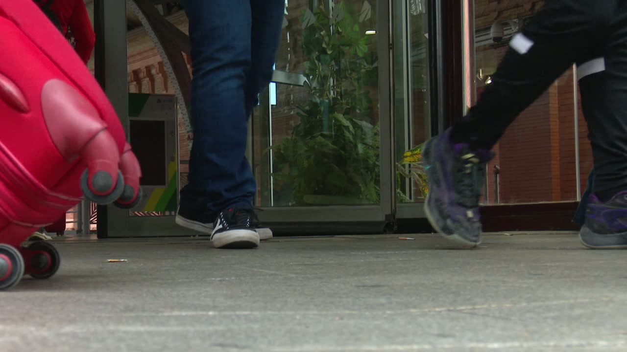 People with Luggage at Airport