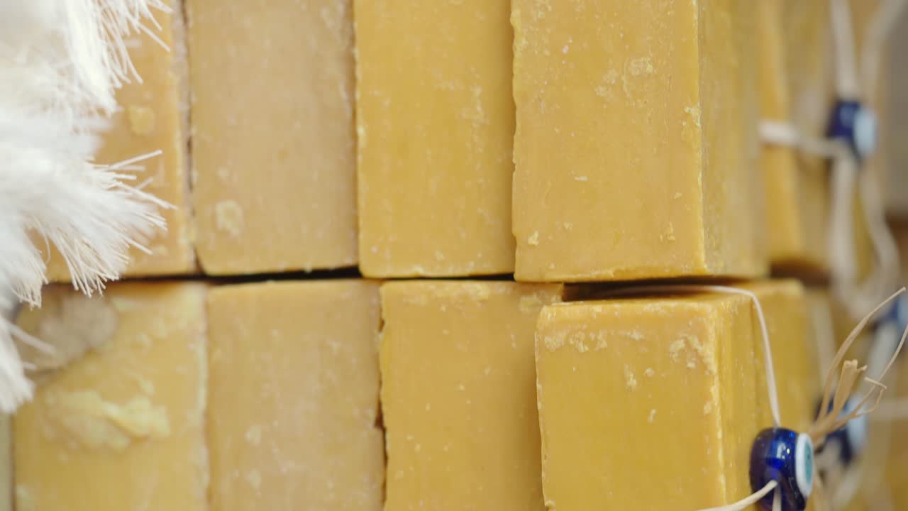 Stacked Bars of Yellow Soap with Turkish Eye Decorations