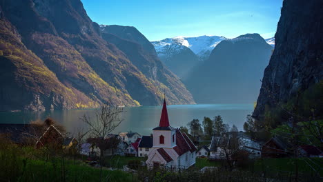 fast moving shot of flam, village with a church in flamsdalen, at the aurlandsfjord a branch of sognefjord which is municipality of aurland in norway