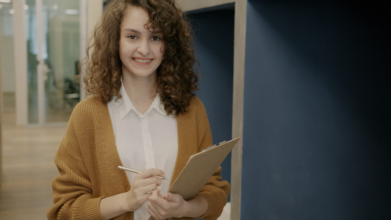 Woman in Office Taking Notes