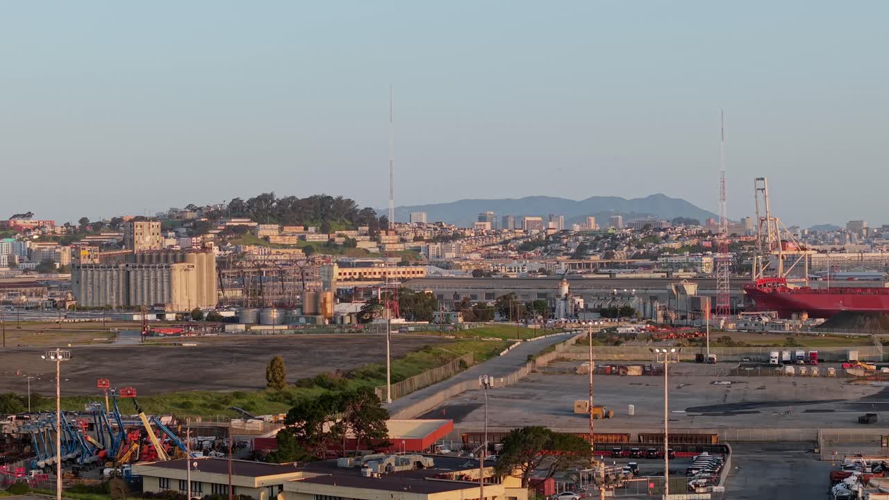 A slow aerial zoom out view of the India Basin neighborhood and San Francisco cityscape in the distance. Shot in 4K.