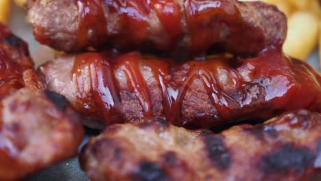 grilled meat with ketchup and fries