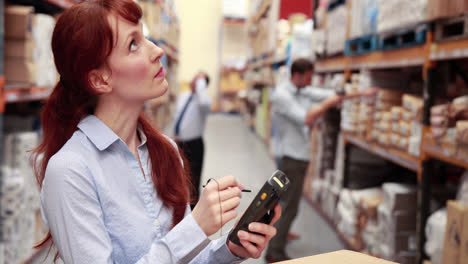 warehouse manager using a touchscreen device