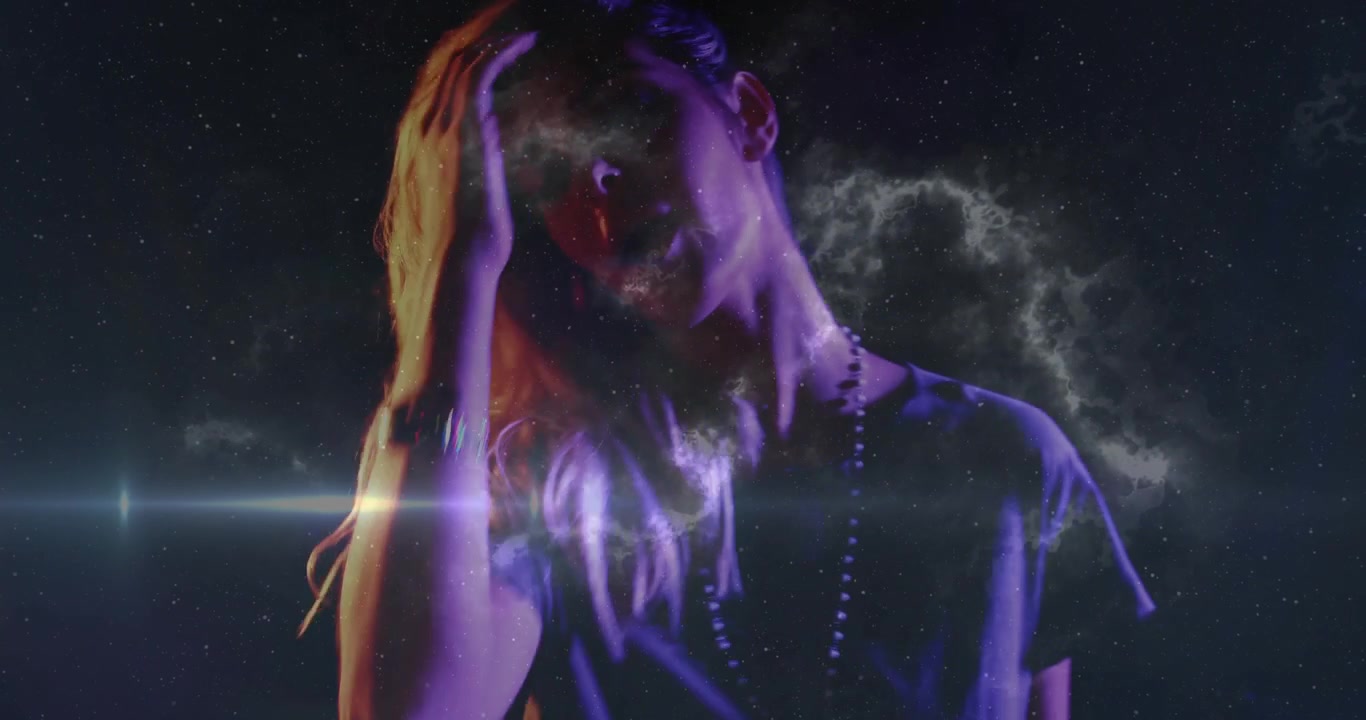 Woman musician playing synth sparking nebula flares, cam rising casting stars on face for portrait