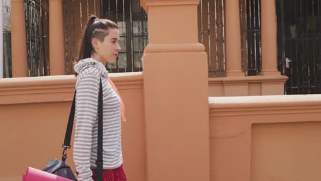 caucasian woman walking in the street