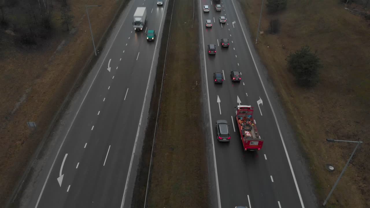 Close up view over highway people driving car or truck on rush hour making traffic jam, tilt up shot
