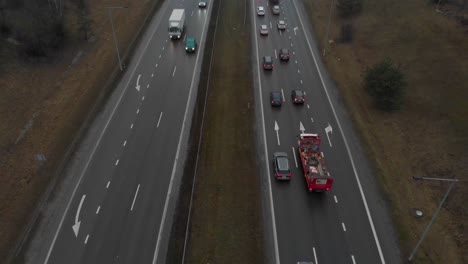 close up view over highway people driving car or truck on rush hour making traffic jam, tilt up shot
