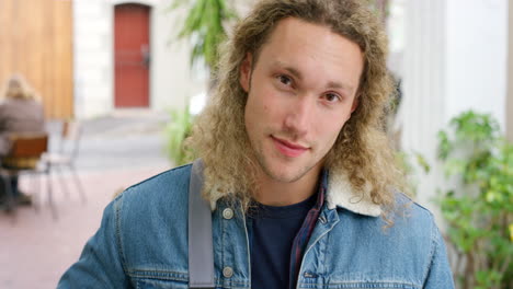 portrait of a handsome male student with bag