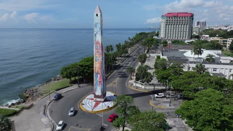 aerial view of santo domingo obelisk monument and roundabout traffic on malecon, dominican republic