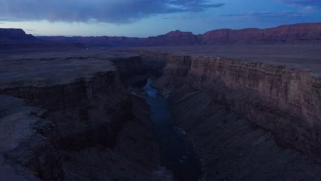 Aerial-flyover-Marble-Canyon,-red-rock-cliffs-of-Arizona-during-dusk